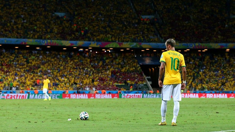 Neymar in Brazil’s number 10 shirt, standing behind the ball on a football pitch.